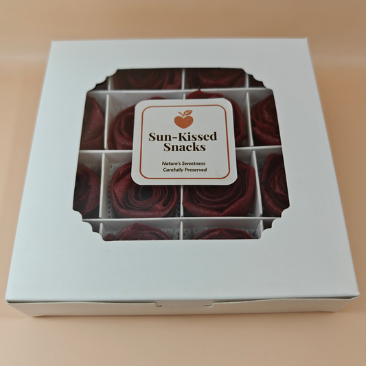Front of Sun-Kissed Snacks gift box with edible rose pastila visible through window